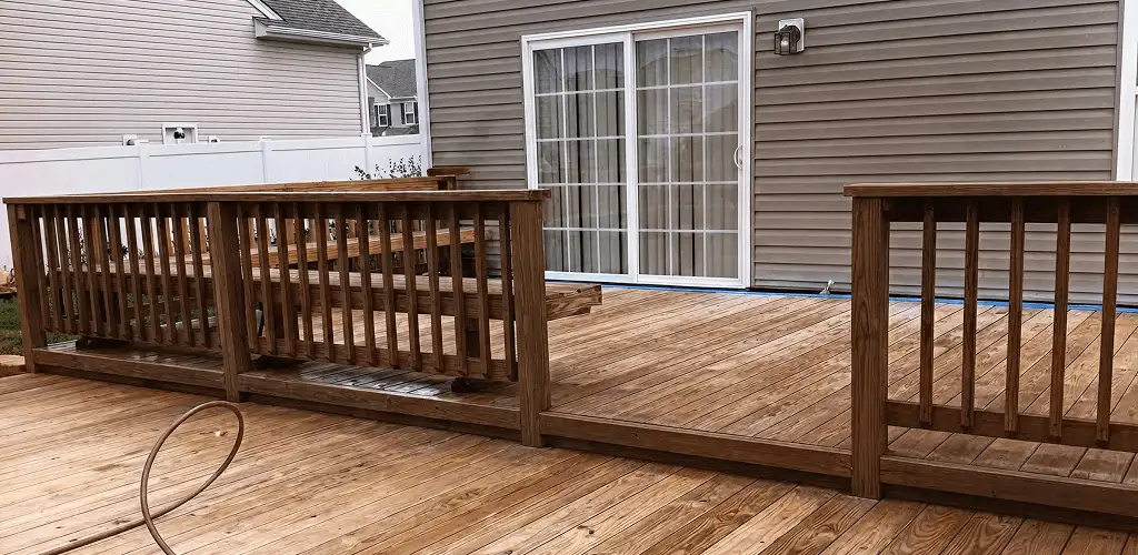 Deck sealing service protecting a backyard wood deck and railings in Provo, UT