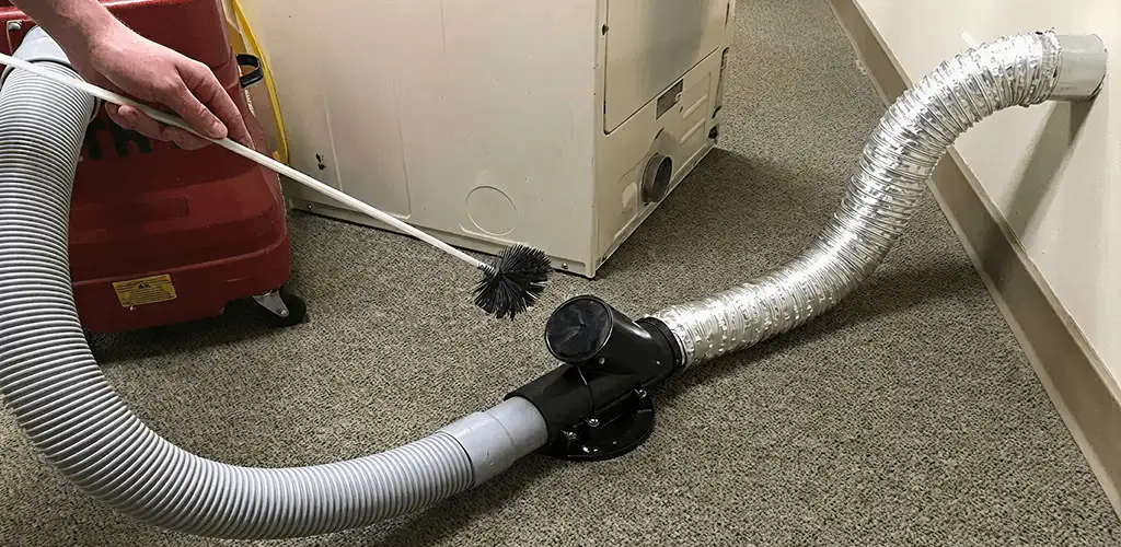 Dryer vent cleaning service removing lint from a dryer duct connection in Provo, UT
