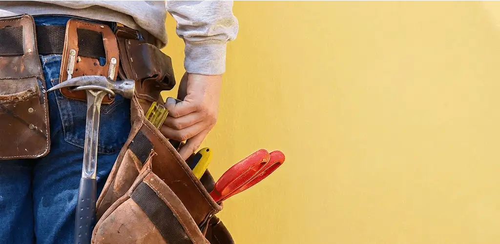 Handyman with tool belt ready for home repairs and maintenance in Provo, UT